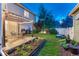 Well-maintained backyard featuring a patio with pergola and a garden area at 13053 Umatilla Ct, Denver, CO 80234
