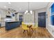 Dining area with kitchen island and yellow chairs at 13053 Umatilla Ct, Denver, CO 80234