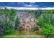 Exterior of a charming two-story home with lush landscaping at 13053 Umatilla Ct, Denver, CO 80234