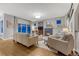 Spacious living room featuring a fireplace, hardwood floors, and comfortable seating arrangement at 13053 Umatilla Ct, Denver, CO 80234