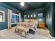 Comfortable main bedroom with moody decor, large window, and textured walls at 13053 Umatilla Ct, Denver, CO 80234