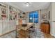 Well-lit office space with built-in bookshelves and a view of the front yard at 13053 Umatilla Ct, Denver, CO 80234