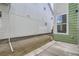 Backyard features concrete patio and modern green-and-white siding at 910 Promenade Dr, Superior, CO 80027