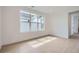 Well-lit bedroom with a large window and light hardwood flooring at 910 Promenade Dr, Superior, CO 80027
