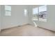 Bright bedroom with hardwood floors, base trim, and multiple windows at 910 Promenade Dr, Superior, CO 80027