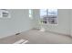 Well-lit bedroom featuring carpet, base trim, and a window at 910 Promenade Dr, Superior, CO 80027