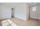 Sunlit bedroom with hardwood floors, white walls, and neutral decor at 910 Promenade Dr, Superior, CO 80027