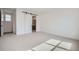 Bedroom featuring carpet, base trim, and a sliding door to a bathroom at 910 Promenade Dr, Superior, CO 80027