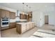 Modern kitchen with a large island, stainless steel appliances, and hardwood floors at 910 Promenade Dr, Superior, CO 80027