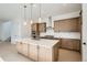 A kitchen featuring a large island with stone countertops and stainless steel appliances at 910 Promenade Dr, Superior, CO 80027