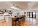 Modern kitchen with stainless steel appliances and an island at 11922 W 77Th Dr, Arvada, CO 80005