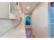 Laundry room with built-in shelving and additional counter space at 11922 W 77Th Dr, Arvada, CO 80005