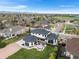 Stunning aerial view of the home showcasing its architecture and landscaping in a desirable neighborhood at 8240 W Tennessee Ave, Lakewood, CO 80226