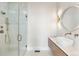 Modern bathroom featuring a glass-enclosed shower, vessel sink and stylish fixtures at 8240 W Tennessee Ave, Lakewood, CO 80226
