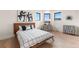 Bedroom featuring neutral walls, hardwood flooring, designer desk and chair, and minimalist decor at 8240 W Tennessee Ave, Lakewood, CO 80226