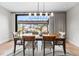 Dining room with natural light and seamless outdoor access, perfect for elegant dinners at 8240 W Tennessee Ave, Lakewood, CO 80226