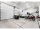 Spacious garage with ample storage space and room for multiple vehicles and a motorcycle at 8240 W Tennessee Ave, Lakewood, CO 80226