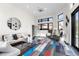 Bright living room with modern decor and large windows, perfect for entertaining at 8240 W Tennessee Ave, Lakewood, CO 80226