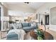 Bright, open living room flows into a modern kitchen, perfect for entertaining and everyday living at 8240 W Tennessee Ave, Lakewood, CO 80226