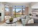 Bright living room offers abundant natural light and views of the professionally landscaped yard at 8240 W Tennessee Ave, Lakewood, CO 80226