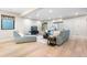 A beautifully decorated living room with hardwood floors, a comfortable sofa, and stylish decor at 8240 W Tennessee Ave, Lakewood, CO 80226