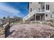 Backyard with a large patio, steps leading to the deck, and mature landscaping at 12291 Coral Burst Ct, Parker, CO 80134