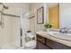 Modern bathroom featuring glass shower, tile accents, and vanity with decorative plant at 12291 Coral Burst Ct, Parker, CO 80134
