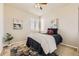 Cozy bedroom with natural light, a plush bed, and decorative accents for a comfortable feel at 12291 Coral Burst Ct, Parker, CO 80134