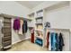 Walk-in closet featuring ample storage space, shelving, and clothing racks for organization at 12291 Coral Burst Ct, Parker, CO 80134