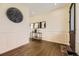 Elegant foyer featuring hardwood floors, decorative wall paneling, and stylish decor at 12291 Coral Burst Ct, Parker, CO 80134