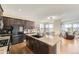 Spacious kitchen features an island, stainless steel appliances, and an eat-in area, ideal for cooking and dining at 12291 Coral Burst Ct, Parker, CO 80134