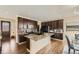 Stylish kitchen with large island, granite countertops, stainless steel appliances, and dark cabinets at 12291 Coral Burst Ct, Parker, CO 80134