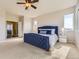Serene main bedroom with a plush carpet, a large window, and a stylish blue bed frame at 12291 Coral Burst Ct, Parker, CO 80134