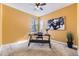 Office space with stylish desk, artwork, and natural lighting creating an inviting atmosphere at 12291 Coral Burst Ct, Parker, CO 80134