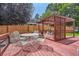 Landscaped backyard with deck and pergola at 8272 Bighorn Ct, Lone Tree, CO 80124