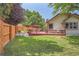 Large backyard with deck and wooden fence at 8272 Bighorn Ct, Lone Tree, CO 80124