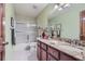 Clean bathroom with granite countertop and tub/shower combo at 8272 Bighorn Ct, Lone Tree, CO 80124