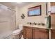Simple bathroom with shower and granite vanity at 8272 Bighorn Ct, Lone Tree, CO 80124