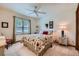 Charming bedroom with floral bedding and a ceiling fan at 8272 Bighorn Ct, Lone Tree, CO 80124