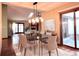 Dining area with glass table and access to backyard at 8272 Bighorn Ct, Lone Tree, CO 80124