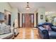 Bright entryway with hardwood floors and wood door at 8272 Bighorn Ct, Lone Tree, CO 80124