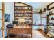 Home office with built-in bookshelves and desk at 8272 Bighorn Ct, Lone Tree, CO 80124