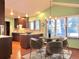 Eat-in kitchen with granite counters and hardwood floors at 8272 Bighorn Ct, Lone Tree, CO 80124