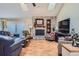 Living room with stone fireplace and hardwood floors at 8272 Bighorn Ct, Lone Tree, CO 80124