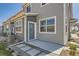 Rear exterior featuring a patio, pavers and grey siding at 4327 E 98Th Pl, Thornton, CO 80229