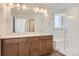 Spacious bathroom with double sinks, quartz countertops, and glass-enclosed shower at 4327 E 98Th Pl, Thornton, CO 80229