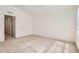 Well lit bedroom with neutral carpet and white trim with doorway visible at 4327 E 98Th Pl, Thornton, CO 80229
