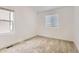 Well lit bedroom featuring neutral color paint, base trim and carpeting at 4327 E 98Th Pl, Thornton, CO 80229