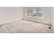 Sun-filled bedroom with carpet, a window, and white trim throughout at 4327 E 98Th Pl, Thornton, CO 80229