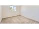 Bright bedroom features a window letting in natural light and neutral carpeting at 4327 E 98Th Pl, Thornton, CO 80229